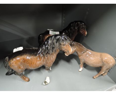 A selection of vintage ceramic figurines including Beswick Donkey some AF