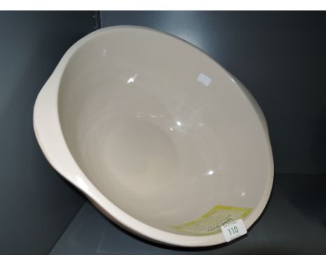 A large ceramic kitchen mixing bowl in two tone