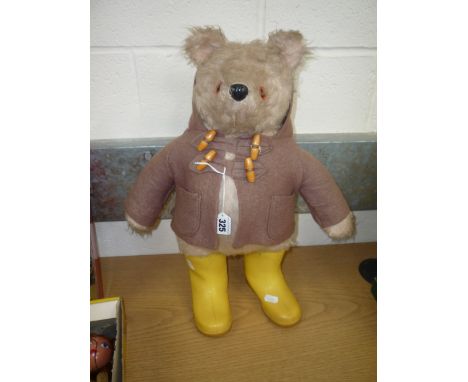 A GABRIELLE DESIGNS PADDINGTON BEAR, missing hat and label, but has fawn duffel coat and yellow Dunlop wellington boots, Gabr