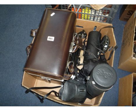 A YASHICA TL-ELECTRO SLR CAMERA, with Yashinon D5 50mm 1:1.9 lens, a Soligor 400mm 1:6.3, a Soligor 300mm 1:5.5 Telephoto len