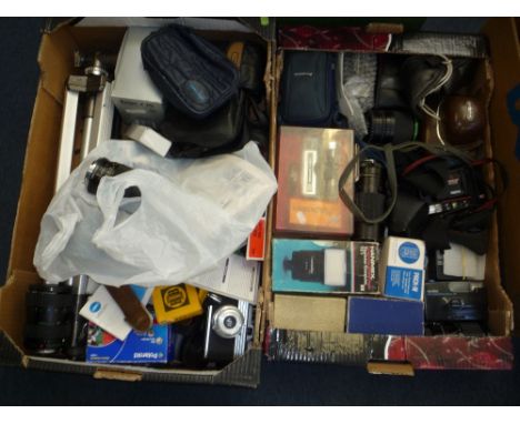 TWO BOXES OF SLR AND INSTANT CAMERA AND EQUIPMENT, including Canon, Bell and Howell, Minolta lenses of differing sizes