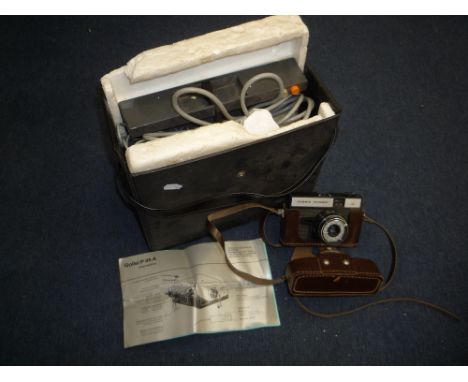 A ROLLI P35A SLIDE PROJECTOR, in case with an OMO camera