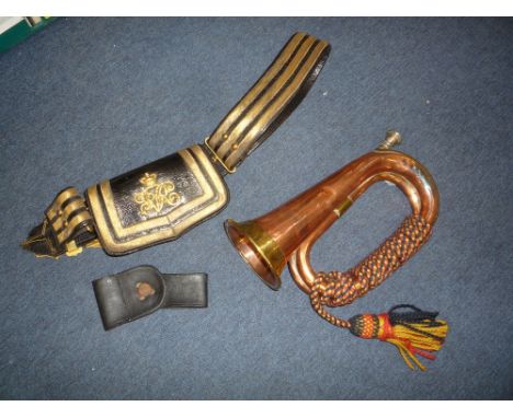 A U.S. LEATHER BAYONET FROG, a copper British Army bugle and a Victorian Officers Cross belt