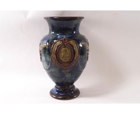 A Royal Doulton earthenware vase, each side with a portrait in relief of an aristocratic gentleman and lady, joined by beaded