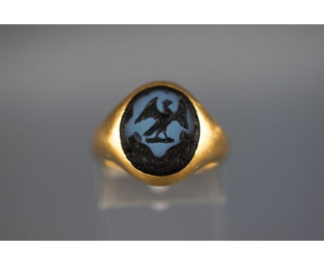 An 18 carat signet ring set with seal of liver bird. Hallmarked 18ct, Birmingham. 'CG&S' 8.8 grams boxed