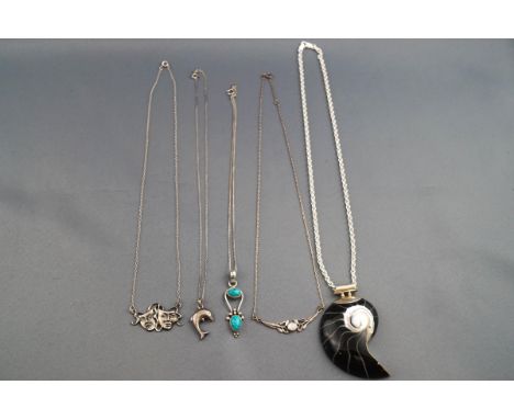 A selection of five miscellaneous pendants and necklaces to include one large shell pendant on chain. Each stamped or hallmar