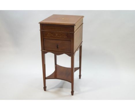 An Edwardian mahogany and marquetry cabinet, the top opening to reveal a baize lined interior above one drawer, on square tap