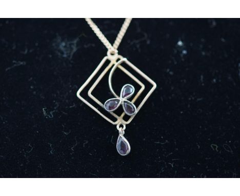 A stamped 9C square pendant of abstract design set with amethyst, suspended from a hallmarked 9ct gold curb chain, bolt ring 