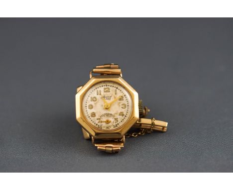A yellow gold Accurist wristwatch. Round champagne figure dial with additional second hand dial. Yellow gold brick link brace
