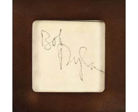 Bob Dylan: A Framed Autograph,in black felt-tip pen on a small scrap of (Metropolitan Police?) notepaper, believed 1960s, app