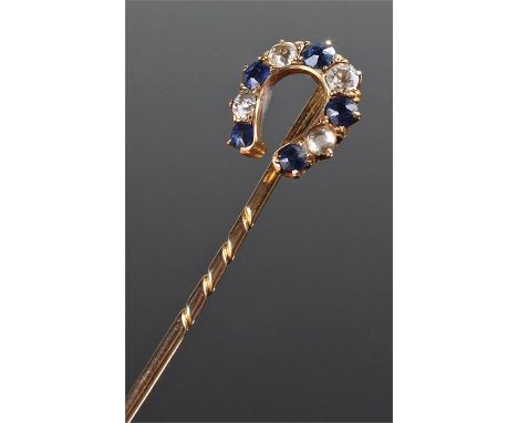 Edwardian sapphire and diamond stick pin, the horse shoe design set with five sapphires and four diamonds, the shoe 13mm diam