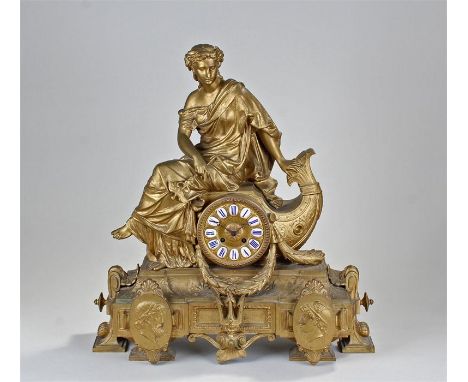 Victorian spelter clock of large proportions, surmounted by a classical figure above a reef and figural mounts The dial with 
