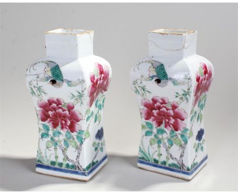 Pair of Chinese famille rose vases. The rectangular neck over rounded shoulders and a waisted body. Decorated in enamels with