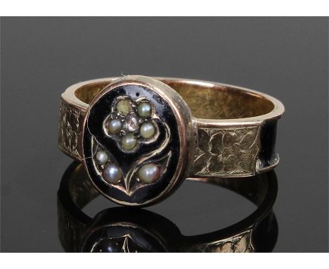 Victorian mourning ring, the yellow metal ring with enamel and pearl decoration centred by a diamond, text to the inner shank