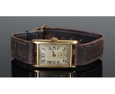 Early 20th Century 18 carat gold gentleman's wristwatch. The rectangular dial with Arabic hours and subsidiary seconds dial, 