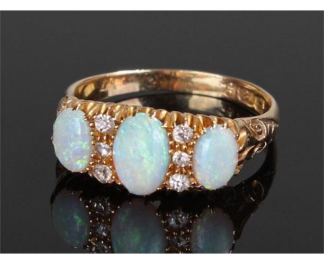 18 carat gold opal and diamond set ring, with three opals and six diamonds, ring size P