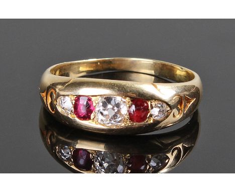 Diamond and ruby ring. The three rose cut diamonds interspaced with rubies and set in 18 carat gold