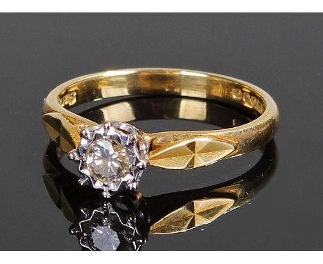 18 carat gold diamond ring. The diamond set ring in a platinum mount and angled shoulders, ring size M