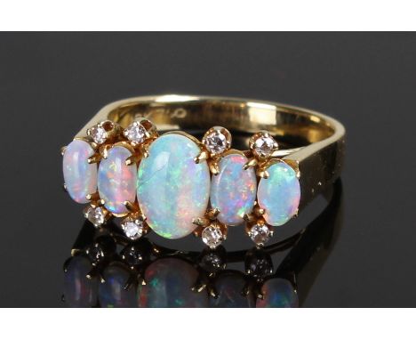 18 carat gold diamond and opal ring, set with five opals and eight diamonds, ring size N