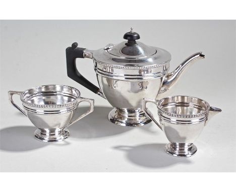 George V silver three piece tea service, Birmingham 1929, maker Barker Bros Ltd, to include a teapot, sugar bowl and milk jug