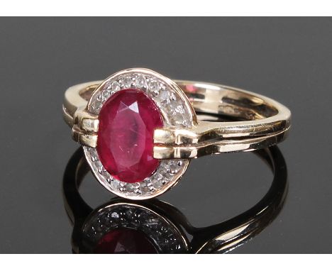 9 carat gold ruby and diamond ring, the central ruby with diamond surround, ring size P