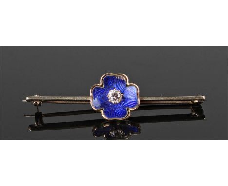 Yellow metal enamel and diamond set brooch. The blue enamel flower head with central diamond and bar back, 53mm wide