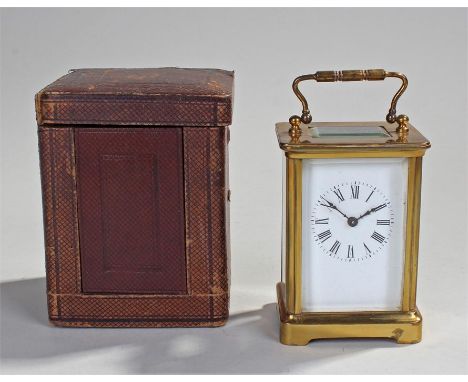French gilt brass carriage clock. The five glass case with white enamel dial and Roman hours, lever platform escapement, 14cm