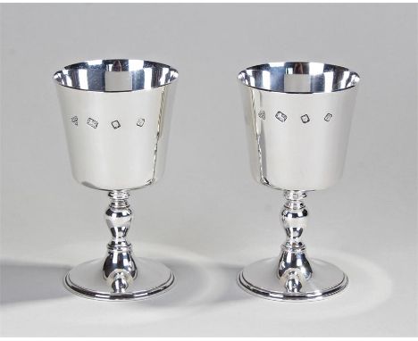 Pair of Elizabeth II silver goblets, London 1971, maker Garrard & Co Ltd, the deep bowls above vase columns and circular base