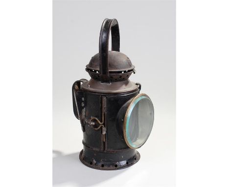 Railway signal lamp. The twist handle rotating to reveal a red glass, green glass and vacant opening above a pierced base, 32