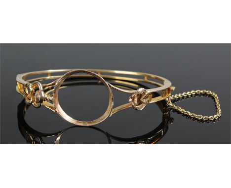 Yellow metal watch holder, probably high carat, the arched bangle with watch insert, 13.9 grams