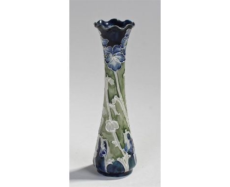 William Moorcroft for Macintyre "Florian" vase. The frilled edge over a trumpet shaped body decorated with tube lined flowers