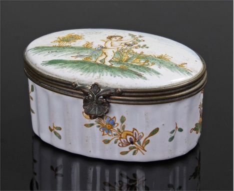18th Century enamel snuff box, the lid with a white ground and a standing cherub on grass, a ribbed body with foliate sprigs,
