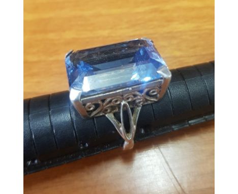 Ornate Silver ring set with large rectangular blue semi-precious stone, overall weight 10.8g (estimated weight of stone 3g ap