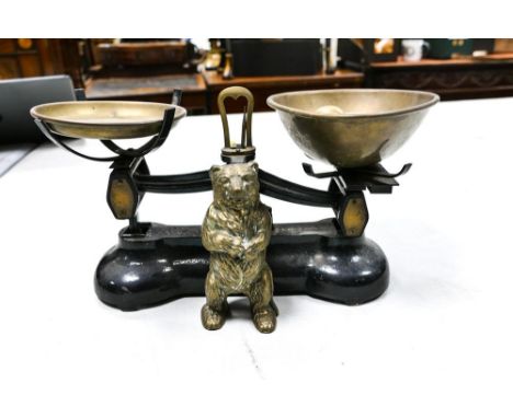 A pair of Libra vintage kitchen scales together with a brass bear money box 