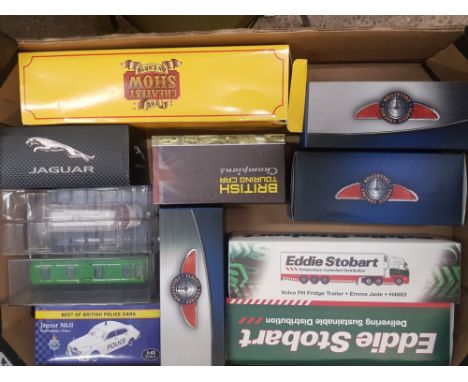 A mixed collection of boxed toy cars to include eddie stobart, classic coaches collection, jaguar, vintage touring car champi