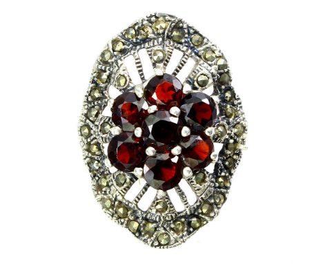 A 925 silver and marcasite ring set with garnets, (R).