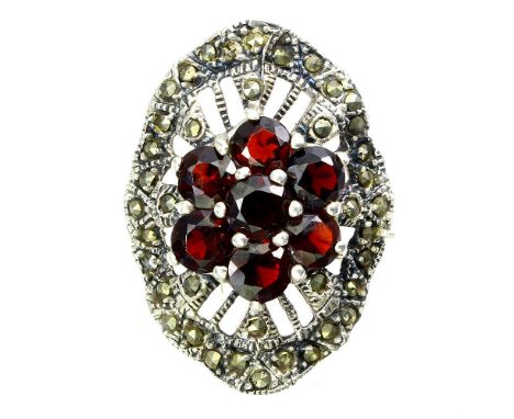 A 925 silver and marcasite ring set with garnets, (R).