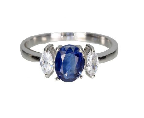 A 925 silver ring set with an oval cut sapphire and white stones, (S).