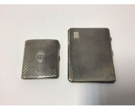 Two silver cigarette cases with engine turned decoration, one hallmarked Birmingham 1924, the other Birmingham 1935, total we