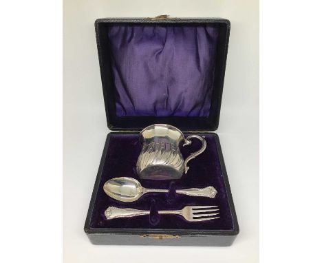 An Edwardian silver Christening set in fitted case, comprising mug, fork and spoon, Birmingham 1905, 2.7oz