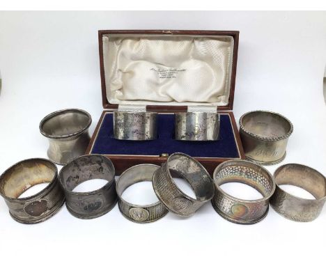 Group of nine silver napkin rings, 6.6oz, together with one other plated napkin ring (10)