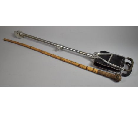 A Vintage Adjustable Shooting Stick together with a Bamboo Walking Cane with Carved Handle 