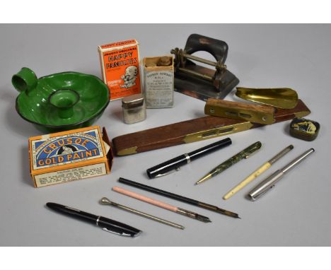 A Collection of Curios to Include Green Enamelled Chamber Stick, Vintage Hole Punch, Brass Mounted Spirit Level, Happy Family