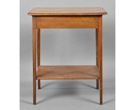 An Edwardian Oak Rectangular Occasional Table with Stretcher Shelf and Canted Corners, 55cms Wide 