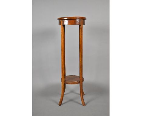 An Edwardian Oak Circular Topped Jardiniere Stand, with Stretcher Shelf, One Section Requires Refixing 