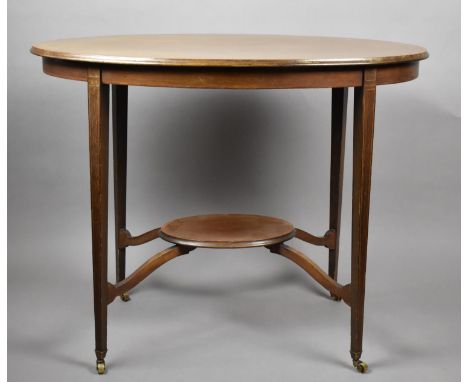 An Edwardian Oval Walnut and Mahogany Occasional Table with Oval Stretcher Shelf 