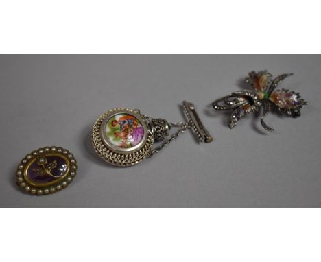 An Enamelled Silver Floral Brooch, Miniature Continental Perfume Flask Brooch and an Oval Pearl Bordered Floral Brooch 