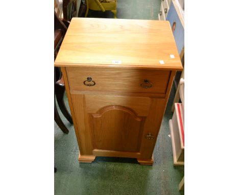 A modern light oak side cabinet, single drawer over fielded panel door cupboard. 92cm high x 55cm wide x 42.5cm deep.