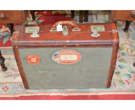 A vintage canvas; a leather suitcase, Cunard Queen Mary, New York to Southampton stickers