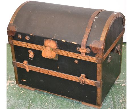 An early 20th century dome top travel trunk, copper and leather binding